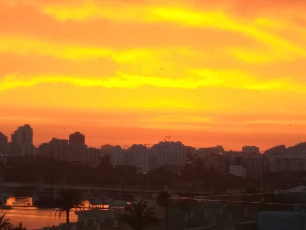 sunset over the sea at ferragudo